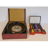 Roulette wheel with various counters and green cloth, boxed and separate box for extra counters (2