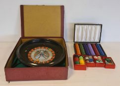 Roulette wheel with various counters and green cloth, boxed and separate box for extra counters (2