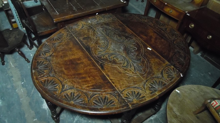 Late 19th century oak gateleg table, the top with carved decoration, on turned and block legs, - Image 5 of 5