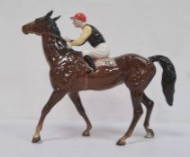 Beswick pottery model of horse with jockey up, 22cm high  Condition ReportOne horse's ear has been