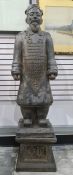Large painted concrete replica of a warrior from the Terracotta Army on marble plinth, combined