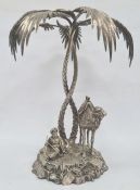 Victorian silver-plated figural centrepiece modelled as a seated figure smoking, with camel under