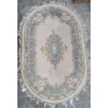 Chinese oval rug, cream ground with blue decoration
