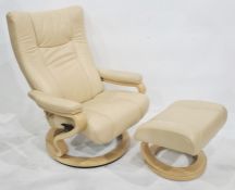 Stressless type easy chair and footstool in cream leather upholsteryCondition ReportThe condition is