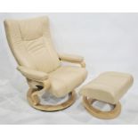 Stressless type easy chair and footstool in cream leather upholsteryCondition ReportThe condition is