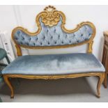 Reproduction French style settee with carved shell motif to the back on cabriole legs