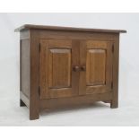 20th century oak two-door cupboard, the rectangular top above two cupboard doors enclosing