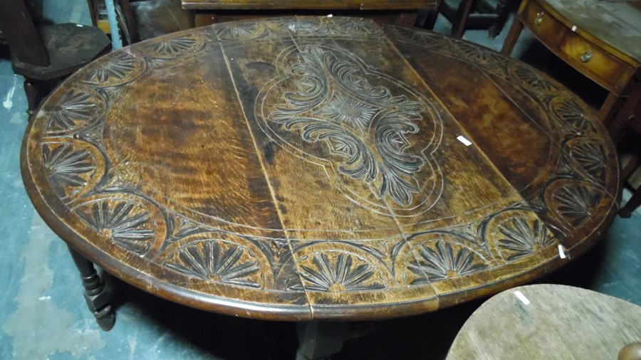 Late 19th century oak gateleg table, the top with carved decoration, on turned and block legs, - Image 2 of 5