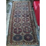 Eastern runner with two rows of nine medallions, in blues, reds and whites, 278cm x 123cm