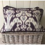 Pair Zoffany Ikat and purple velvet cushions