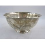 American silver bowl of plain circular form on collet foot, the base with retailer's mark for Reed &
