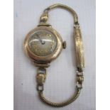 Lady's gold Moba bracelet watch with gilt numerals in circular case, marked 9c, and on rolled gold