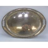 Early 20th century silver two-handled oval tray with gadrooned border, with reeded rim,