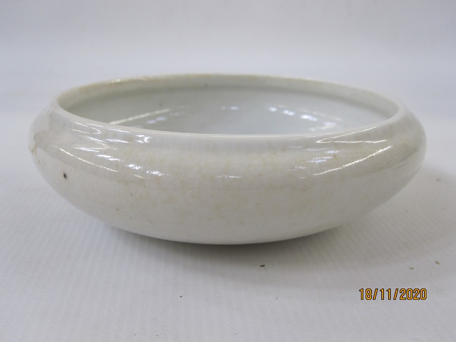 Chinese ivory glazed porcelain brushwasher, circular with incurved rim, crackle glazed base, 14cm