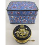 Eastern enamel box and cover with allover pink flowerhead decoration on a blue ground,