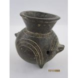 Archaeological find, a small antique black pottery two handled jar with flared rim, the body with