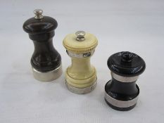 Modern turned wooden pepper grinders with silver mounts, London 2008, another turned wood example