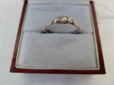 18ct gold and three-stone diamond ring set three claw set stones (the shank cut)
