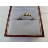 18ct gold and three-stone diamond ring set three claw set stones (the shank cut)