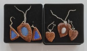 Pair of modern wood and opal pendant earrings, triangular with similar shield-shaped pendant, on