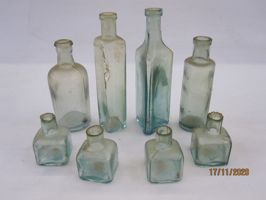 Collection of eight chemist and ink glass bottles including one from Osmond & Son Ltd, Grimsby