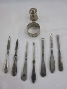 Assorted early 20th century silver-handled manicure items to include nail file, tweezers, cuticle