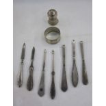 Assorted early 20th century silver-handled manicure items to include nail file, tweezers, cuticle