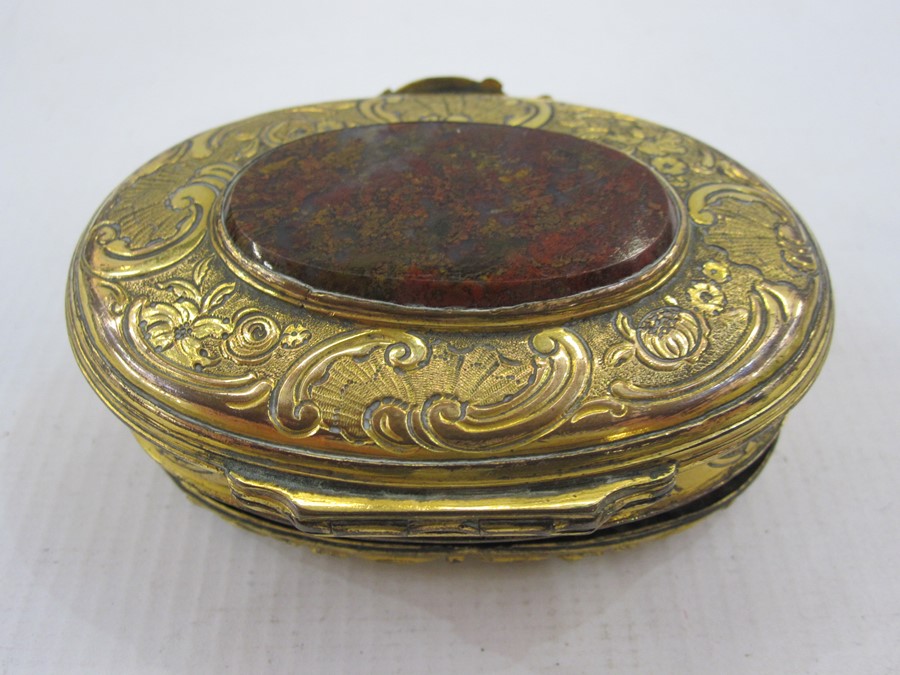 19th century oval gilt metal and onyx trinket box, the oval engraved lid mounted with central oval