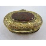 19th century oval gilt metal and onyx trinket box, the oval engraved lid mounted with central oval