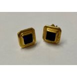Pair gold-coloured metal and blue stone set earrings, each set square stone in stepped surround