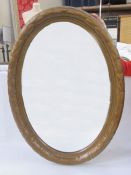 Gilt wall mirror, oval, 70cm x 48cm overall and another, oval, with moulded frame, 88cm x 63cm