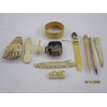 Quantity of antique ivory miniatures to include back scratcher hand, miniature paper knife with