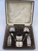 A 1930s Walker & Hall silver six-piece cruet set, in fitted box, blue glass liners, Birmingham 1930,