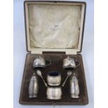 A 1930s Walker & Hall silver six-piece cruet set, in fitted box, blue glass liners, Birmingham 1930,