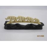 Late 19th/early 20th century carved ivory bridge of four graduated mininature elephants and the