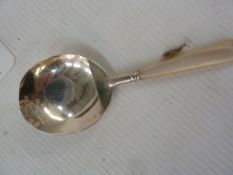 George III silver and mother-of-pearl handled caddy spoon with broad circular flat bowl and lip,