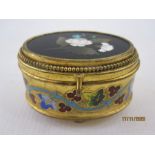 Late 19th century Italian gilt metal jewellery box of oval form, the hinged cover inset with a