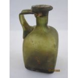 Roman glass unguent flask of square form with single handle, the neck with seal, 13cm high and