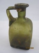 Roman glass unguent flask of square form with single handle, the neck with seal, 13cm high and