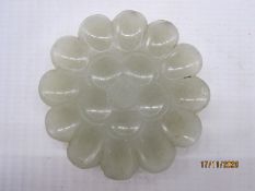 Chinese carved jade plaque, pale celadon, in the form of a flowerhead with concave petals and