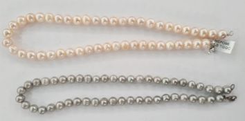Two cultured pearl necklaces, one pink, each pink pearl 1cm diameter approx, 46cm long approx and