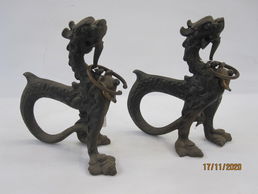Pair 19th century Asian cast metal model dragons with curved tails, 24cm high (2)