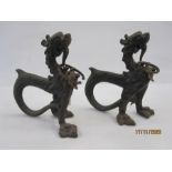 Pair 19th century Asian cast metal model dragons with curved tails, 24cm high (2)