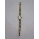 Modern lady's 9ct gold Rotary bracelet watch, the oval dial with baton markers and integral 9ct gold