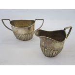 A Victorian silver two handled sugar bowl, angled fluted handles and fluted decoration to body,