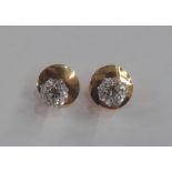 Pair of gold, platinum and diamond stud earrings (gold and platinum unmarked), circular, pair of