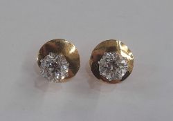 Pair of gold, platinum and diamond stud earrings (gold and platinum unmarked), circular, pair of