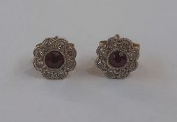 Pair ruby and diamond flower cluster stud earrings set central ruby (worn) and small diamonds