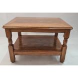 20th century walnut two tier coffee table, the rectangular top with rounded corners, moulded edge on