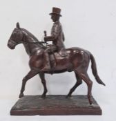 Bronze sculpture of huntsman wearing top hat, on horse, on rectangular stepped bronze base,